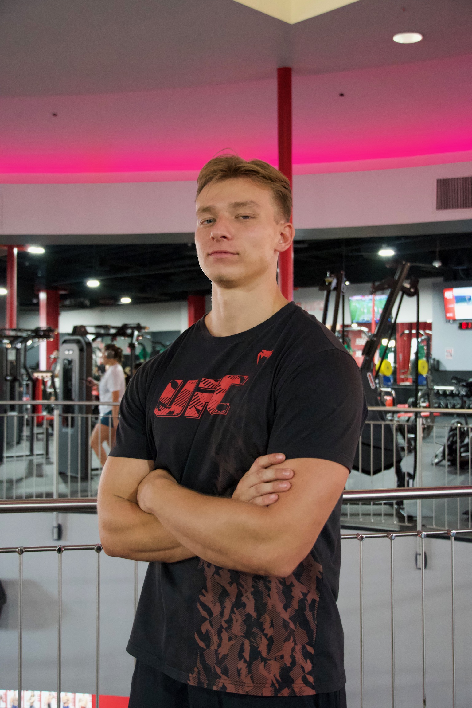 Straight-on portrait of Mason in the gym